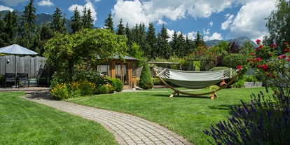 Mountainbike Urlaub - PLZ 8982 (Österreich) - Einfach nur chillen im Ruhegarten mit Bedienung  - Bliem`s Familienhotel